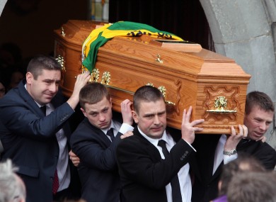 The coffin of Páidi Ó Sé is carried from the local parish church in Ventry, Co Kerry.