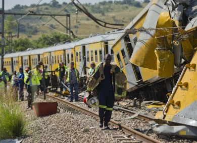 Emergency workers attend the scene of a collision between two trains near Pretoria.