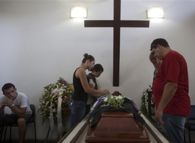 People attend the funeral of Gustavo Goncalves, a victim of the Kiss nightclub fatal fire.