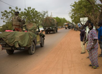 Malian people welcome French soldiers as they arrive in the city of Sevare yesterday