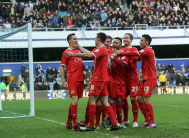 The MK Dons player celebrate with goalscorer Darren Potter.