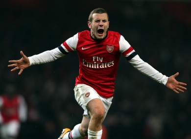 Arsenal's Jack Wilshere celebrates scoring a late winner.
