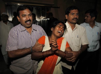 An Indian woman Sujatha, wails after seeing her husband Venkateshwarulu's body, unseen, killed in bomb blast,