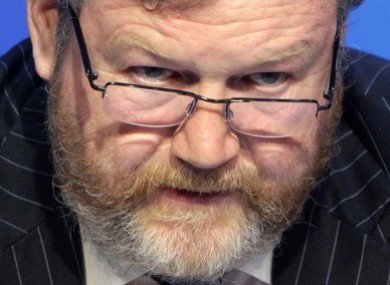 Fine Gael Minister for Health, Dr James Reilly with a copy of the report