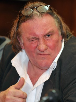 French actor Gerard Depardieu gestures during a press conference with Montenegro Prime Minister Milo Djukanovic