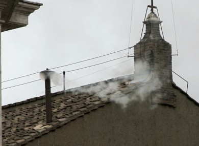 White smoke billows from the chimney atop the Sistine Chapel, at the Vatican, in this April 19, 2005, file photo, to announce the election of Pope Benedict XVI.