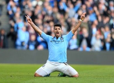 Kun: Aguero celebrates scoring his side's fourth.