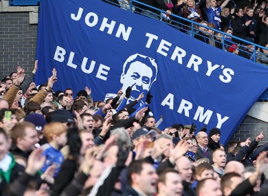 Chelsea fans show their support at Stamford Bridge today.