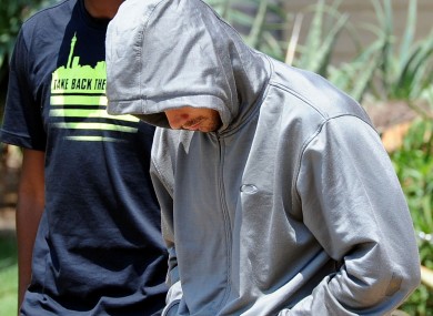 Olympic athlete Oscar Pistorius leaves the Boschkop police station, east of Pretoria, South Africa.