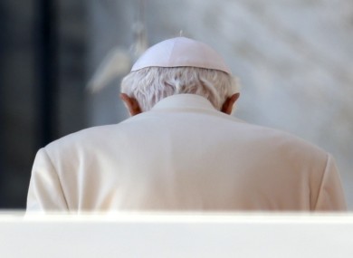 The Pope, hunching over to check his really annoying Twitter mentions