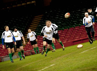 Paddy O'Toole passes to John Moore during the Ireland Police Rugby Team's training session