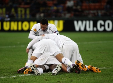 Tottenham Hotspur's Emmanuel Adebayor is under there somewhere.