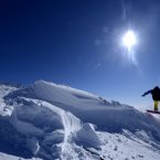 A snow boarder makes a jump at the Yad Moss ski slope in cumbria near Alston. 